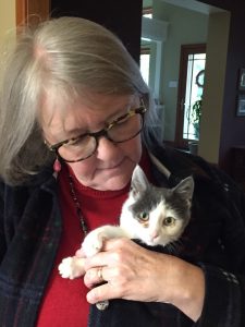 Volunteer Theresa with her foster cat, Wes