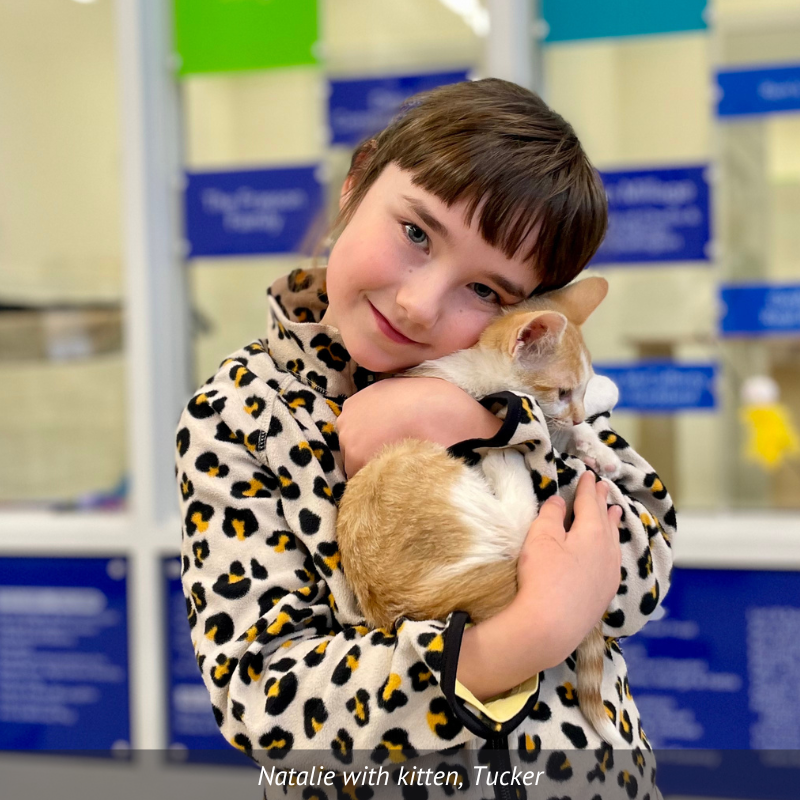 Natalie hugging her kitten, Tucker